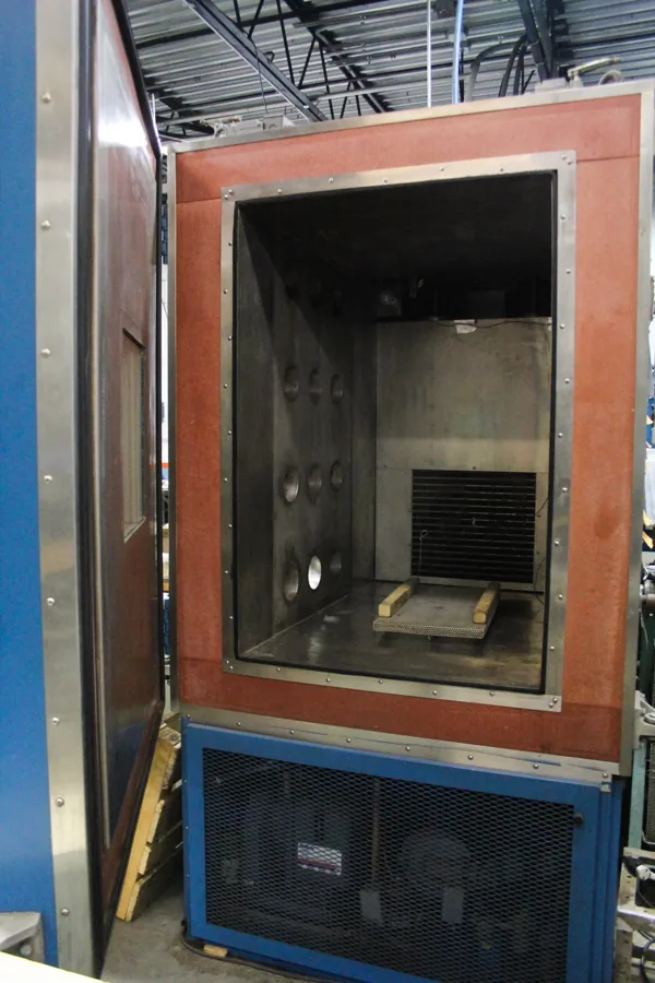 Interior of an environmental chamber with feed-through ports and conditioning unit