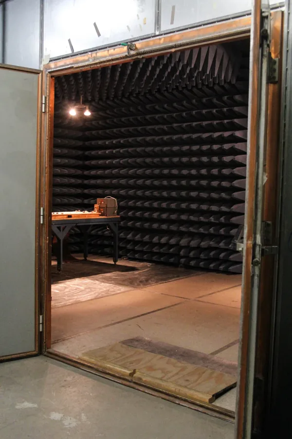 Open copper-lined door of a shielded enclosure with cone-foam interior